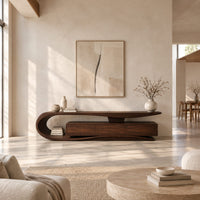 Tv stand with a sweeping loop end and low three panel cabinet in a bright open plan living room