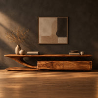 Tv stand with a sweeping plank top and a low two panel cabinet block in a dark studio against a charcoal plaster wall