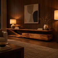 Tv stand with a sweeping plank top and a low two panel cabinet block in an evening living room with walnut wall paneling