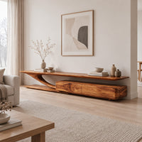 Tv stand with a sweeping plank top and a low two panel cabinet block in a Scandinavian living room with white walls