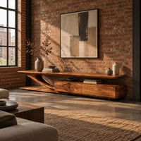 Tv stand with a sweeping plank top and a low two panel cabinet block in an industrial loft living room with exposed brick