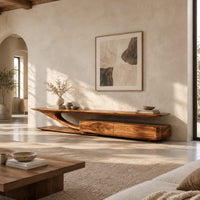 Tv stand with a sweeping plank top and a low two panel cabinet block in a bright open plan living room