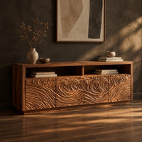 Tv stand with four swirl carved door fronts and two open top bays, three-quarter view showing the grain
