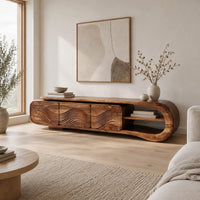 Tv stand with three wave carved fronts and an open looped end shelf in a Scandinavian living room with white walls