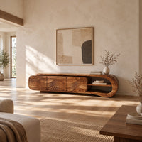 Tv stand with three wave carved fronts and an open looped end shelf in a bright open plan living room
