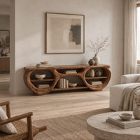 Tv stand with two large oval openings, open shelves and carved organic edges in a Scandinavian living room with white walls
