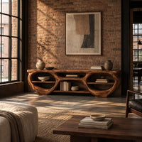 Tv stand with two large oval openings, open shelves and carved organic edges in an industrial loft living room with exposed brick