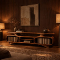 Low tv stand with two oval bays, a center shelf and sculpted feet in an evening living room with walnut wall paneling