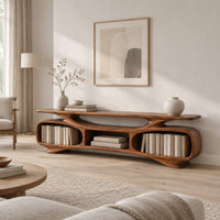 Low tv stand with two oval bays, a center shelf and sculpted feet in a Scandinavian living room with white walls