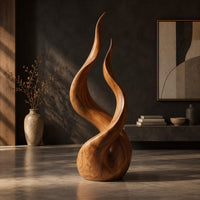 Twin flame wood sculpture with two tall tips and a smooth teardrop base, three-quarter view showing the grain