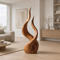 Twin flame wood sculpture with two tall tips and a smooth teardrop base in a Scandinavian living room with white walls