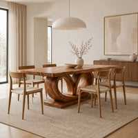 Rectangular dining table on a base of two large open loops in a Scandinavian dining room with white walls