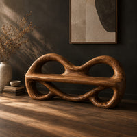Wood bench with two looped openings above a flat plank seat, three-quarter view showing the grain
