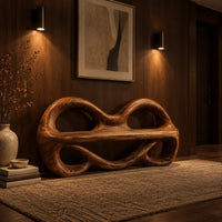 Wood bench with two looped openings above a flat plank seat in an evening entryway with walnut wall paneling