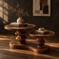 Coffee table with two round tops on carved stems and one shared base, three-quarter view showing the grain