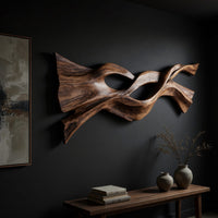 Twin strand wooden wall art with an eye shaped opening, three-quarter view showing the carved depth