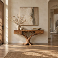 Console table with two small drawers on a twin trunk branching base in a bright open plan entryway