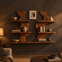 Pair of wavy wood wall shelves with three open shelf levels in a dark living room at golden hour