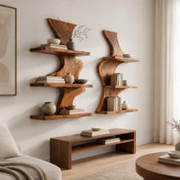 Pair of wavy wood wall shelves with three open shelf levels in a Scandinavian living room with white walls