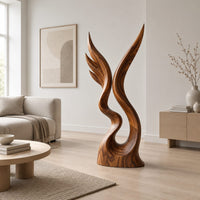 Twin wing sculpture rising from one swirled base to two sharp tips in a Scandinavian living room with white walls