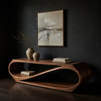Twist loop TV console with a diagonal inner sweep, three-quarter view showing the grain