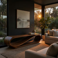 Twist loop TV console with a diagonal inner sweep in a living room at golden hour