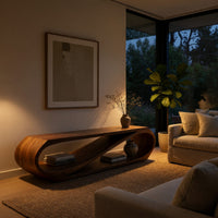 Twist loop TV console with a diagonal inner sweep in an evening room lit by two lamps