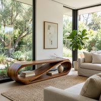 Twist loop TV console with a diagonal inner sweep in a sunlit room with large windows and plants