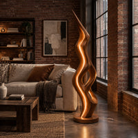 Tall floor lamp with a pointed tip, open twisting body and glowing edges in an industrial loft living room with exposed brick