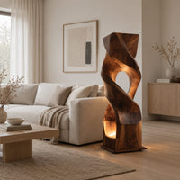 Twisted wooden block floor lamp with an oval window and glowing base opening in a Scandinavian living room with white walls