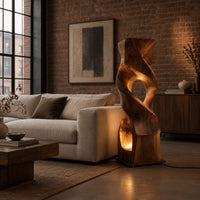 Twisted wooden block floor lamp with an oval window and glowing base opening in an industrial loft living room with exposed brick