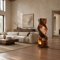 Twisted wooden block floor lamp with an oval window and glowing base opening in a bright open plan living room