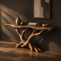 Console table with twisting branch legs, root like feet and a live edge top, three-quarter view showing the grain