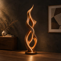 Tall twisted flame floor lamp on a low disc base, three-quarter view showing the grain