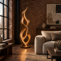 Tall twisted flame floor lamp on a low disc base in an industrial loft living room with exposed brick