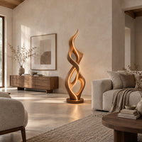 Tall twisted flame floor lamp on a low disc base in a bright open plan living room