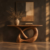 Console table with a twisted knot loop base and an oval top in a dark entryway at golden hour