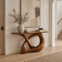 Console table with a twisted knot loop base and an oval top in a Scandinavian entryway with white walls