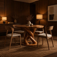 Circular wooden dining table with a twisting braided pedestal on a disc base in an evening dining room with walnut wall paneling