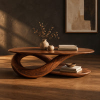 Oval coffee table on a twisted ribbon base with a flat oval shelf below, three-quarter view showing the grain