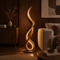 Floor lamp of twisting wooden ribbon with a glowing loop at the base in an evening living room with walnut wall paneling