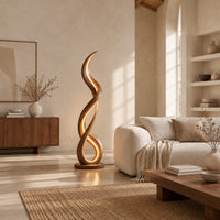 Floor lamp of twisting wooden ribbon with a glowing loop at the base in a bright open plan living room