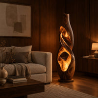 Floor lamp shaped as a twisting vase with open ribbon cutouts that glow in an evening living room with walnut wall paneling