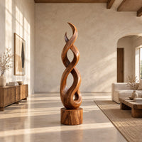 Twisted wood sculpture of intertwined ribbons on a short cylinder base in a bright open plan living room