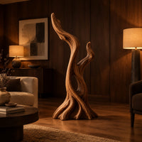 Twisted root style sculpture with an open hollow and two flame shaped tips in an evening living room with walnut wall paneling