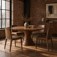Circular dining table with a twisted spiral hourglass pedestal in an industrial loft dining room with exposed brick
