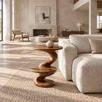Side table with a spiral twisted stem and two round tiers in a bright open plan living room