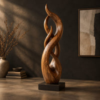 Twisting flame shaped sculpture with braided open loops on a square block base, three-quarter view showing the grain