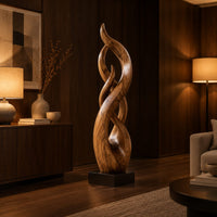 Twisting flame shaped sculpture with braided open loops on a square block base in an evening living room with walnut wall paneling