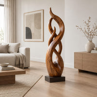 Twisting flame shaped sculpture with braided open loops on a square block base in a Scandinavian living room with white walls